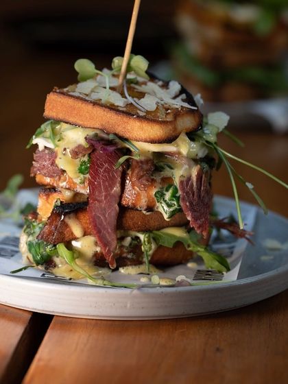 Another angle of our towering ciabatta sandwich, showing the generous fillings and melted cheese.