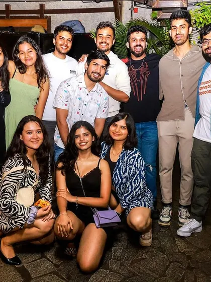 A big group of friends gathered for a photo at Social. It's the perfect spot for a group outing.