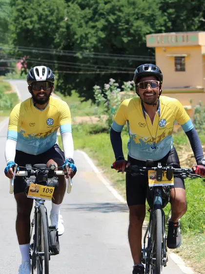 Two riders share a smile during the Western Ghats Odyssey (WER) 1500km race. Even in a self-supported race, the spirit of camaraderie shines through.