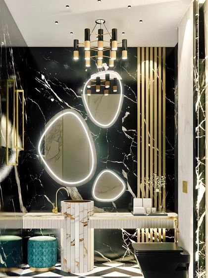 Another view of the powder room with organic-shaped mirrors. This angle highlights the freestanding pedestal sink and the contrast between the black marble and gold accents.