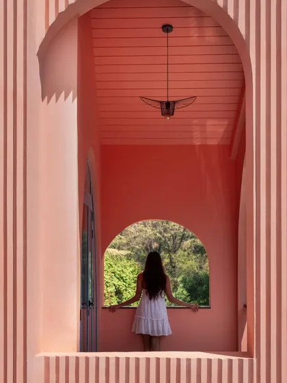 A simple frame can create a profound connection to the surrounding landscape. At Baia Villas, I used architectural openings like this one to encourage moments of pause and appreciation for the natural beauty of Goa.