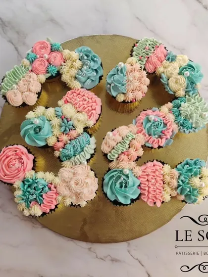 Why have a cake when you can have a cupcake cake? This is a pull-apart creation I made for a 25th birthday, arranging individual cupcakes into the number '25'. It's decorated with a mix of pastel buttercream florals and is perfect for sharing.