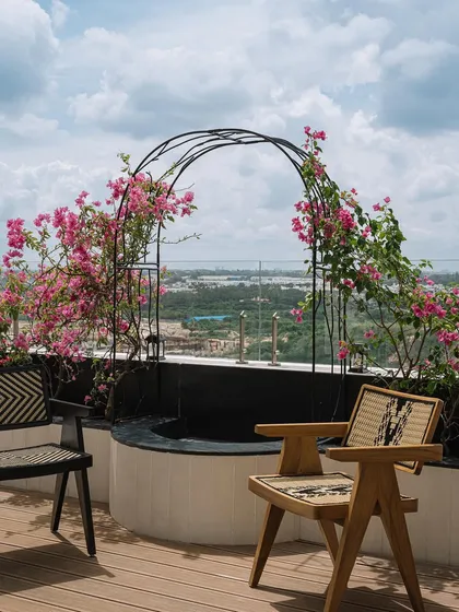 A beautiful shot of the bougainvillea-lined arch on the terrace. This spot frames the view and serves as a focal point for the outdoor space.