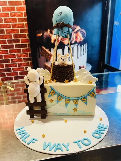 Another adorable "Half way to one" cake with a teddy bear theme and a hot air balloon.