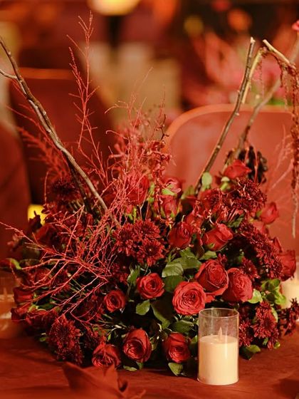 A different angle of the stunning red centerpiece, highlighting its sculptural quality.