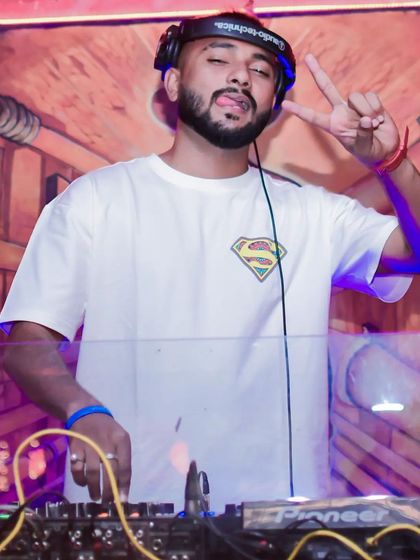 Rocking a Superman shirt behind the console. Sometimes you have to be a hero on the dance floor and save the night with the perfect track.