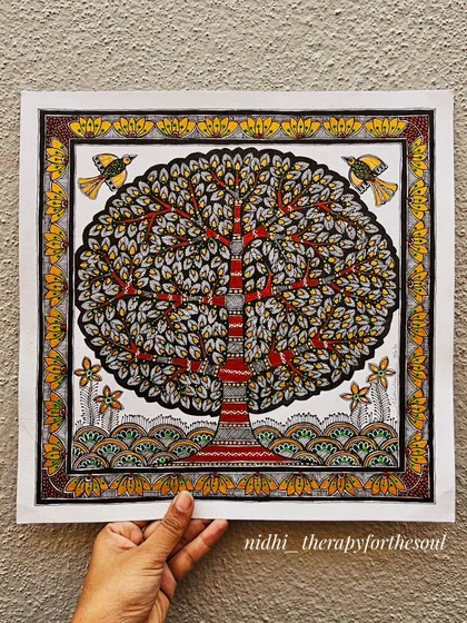 The "Tree of Life" is a powerful symbol, and this is my take on it in the Madhubani style. I used a striking combination of brick red and shimmering gold that really catches the light, with intricate patterns filling every leaf and branch. This original piece is available for sale.