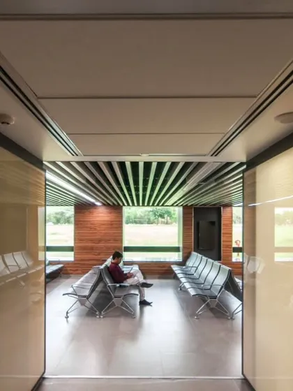 A quiet moment in a waiting area we designed. This space embodies our people-first approach, offering a calm and well-lit environment that considers the human experience at its core.