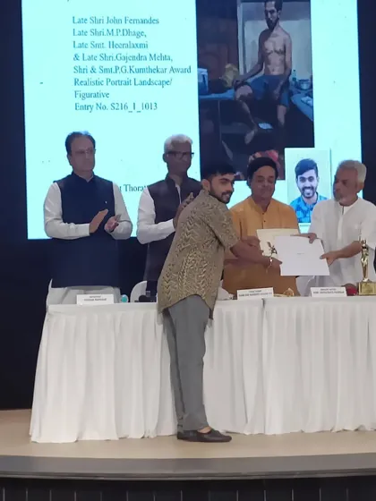 On stage receiving the award at the Jehangir Art Gallery for my painting "Bachelor."