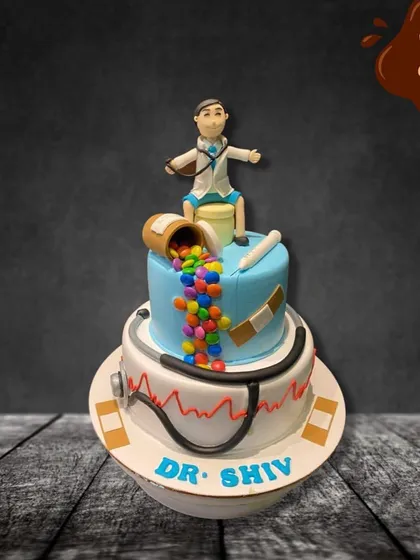 An apple a day is great, but a doctor-themed cake is better for a celebration! This two-tier cake features a stethoscope, bandages, and a doctor figure, with colorful candies pouring out like medicine.