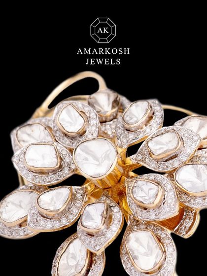 A close-up of the convertible diamond ring and bracelet, showing the intricate floral design made with large, flat-cut polki diamonds.