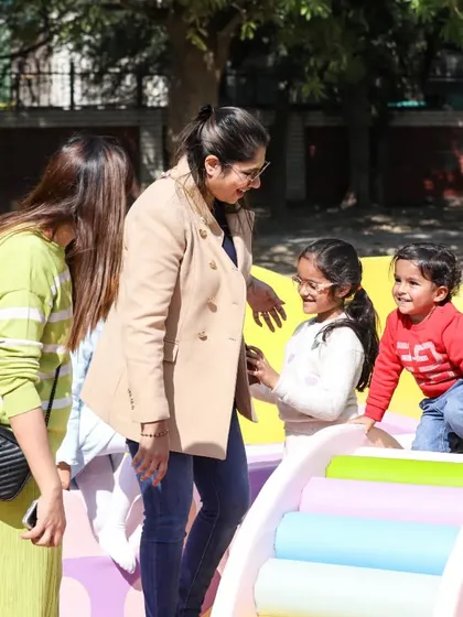 A candid moment of pure joy and interaction between parents and kids in our play area.