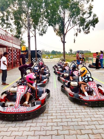 Two full lines of karts ready to hit the track. This is the perfect activity for a big family outing or a corporate team-building event.