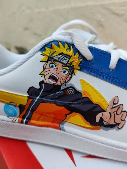 A close up of Naruto himself in action on the custom Nike Court Royales.
