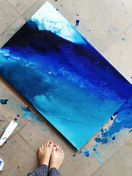 An overhead shot of the abstract ocean painting on my studio floor. I love the beachy vibes and the beautiful turquoise hues that emerged in this piece.