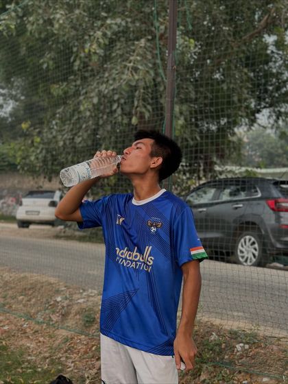 Rehydrating after a tough set of drills. We push our bodies to the limit, and proper recovery starts right on the sidelines.