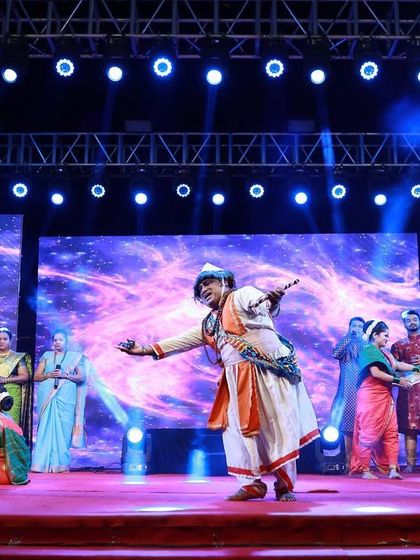 My stage setups are designed to accommodate large groups of performers. This wide shot shows a full cast on stage during a cultural performance, with the lighting and LED screens creating a rich and vibrant backdrop.