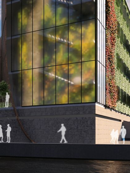 A rendering of a commercial building with a living wall and glass facade. This project is a testament to our ability to design for business excellence, creating an environment that is both professional and architecturally striking.