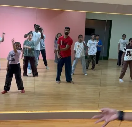 A guest instructor breaking down the steps for our younger students. We occasionally host workshops to expose them to different dance styles.