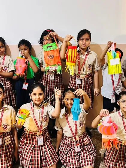 Students proudly display the colorful paper lanterns they crafted for Diwali. This activity not only enhances their creativity but also teaches them about the traditions of the festival of lights.
