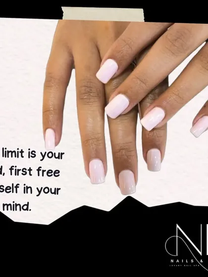 This image showcases a beautiful, soft pink-to-white ombre on shorter, square-shaped nails. It's a perfect example of an elegant, everyday look.