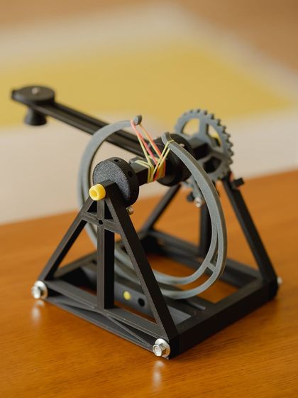 The finished catapult, a testament to the power of gears, levers, and a child's focus.