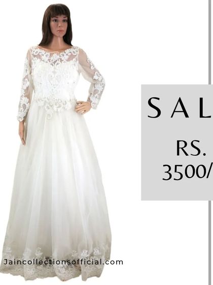 This white lace gown with full sleeves is a classic and elegant piece, on sale for Rs. 3500.