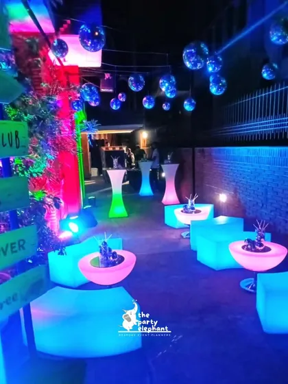 For a high-energy adult celebration, I designed this Ibiza-inspired neon party. The outdoor space was transformed with glowing LED furniture, hanging disco balls, and vibrant uplighting to create a dynamic and stylish nightclub atmosphere.