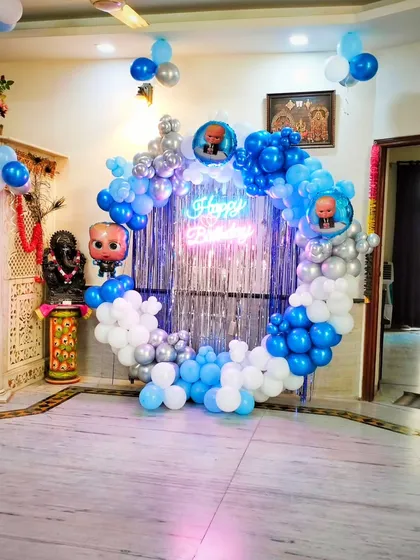 This home-based Boss Baby party setup shows how I can create a fantastic themed backdrop in any space, complete with a Ganesha statue for blessings.