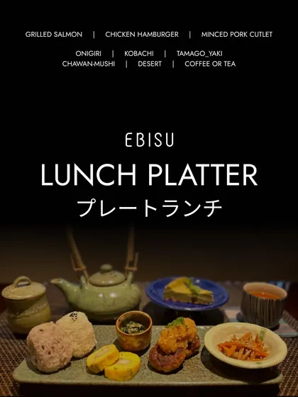 Our Lunch Platter offers a complete and balanced meal. It includes a main like grilled salmon or chicken hamburger, along with onigiri, tamago-yaki, and other small side dishes.