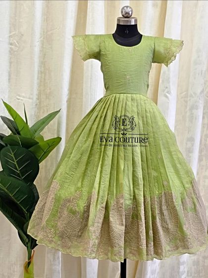 A simple and elegant lime green frock. The subtle texture of the fabric and the flutter sleeves make this a comfortable yet stylish choice.