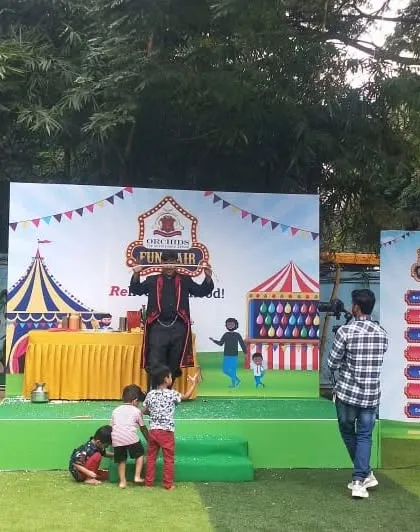 The kids are so excited they've come right up to the stage to catch the confetti. This is the kind of joyful chaos I love to create.