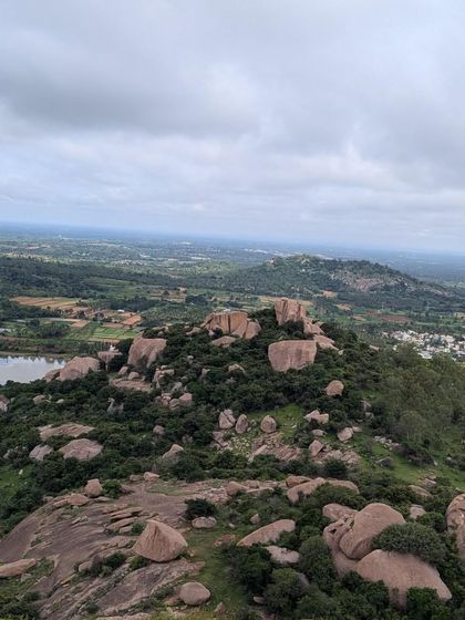 The rocky landscape and serene lake as seen from the top of Nijagal Betta.
