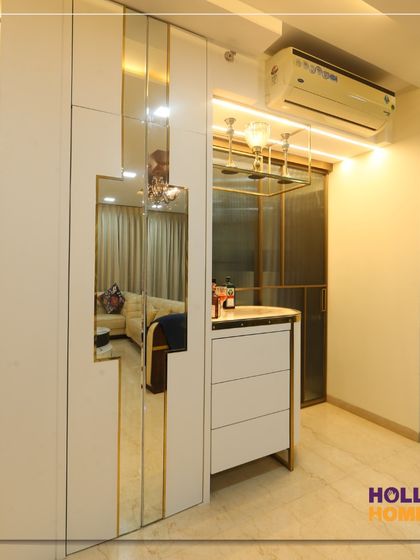 A view of the closed bar unit, which features mirrored panels that blend seamlessly with the living room decor.