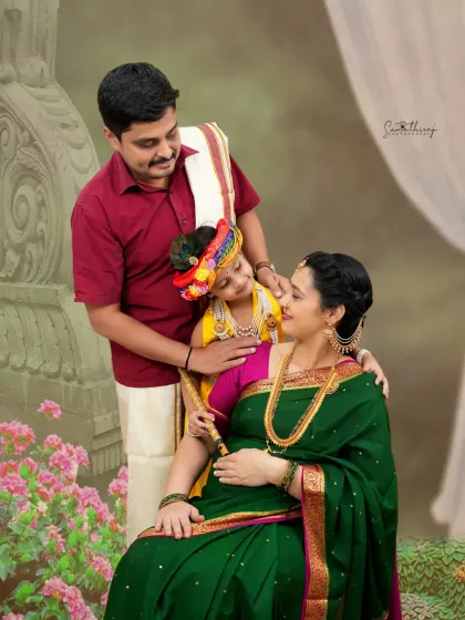 A loving family portrait with a Krishna theme. The father and older son, dressed as Krishna, share a tender moment with the mother-to-be, creating a beautiful and meaningful family photo.