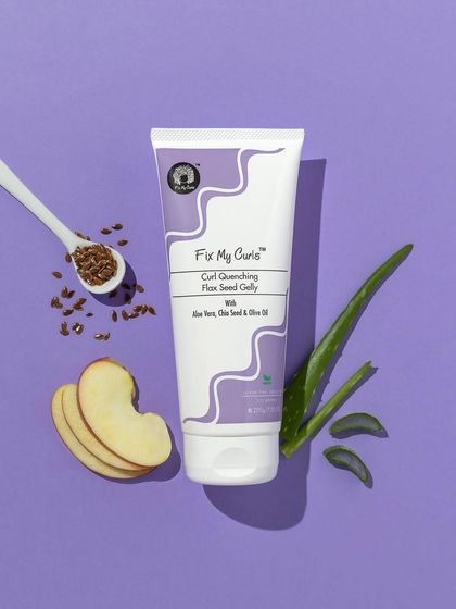 We used a bold purple background to match the product's packaging in this ingredient-focused flatlay. The flax seeds, apple slices, and aloe vera are arranged artfully to tell the story of the formula.