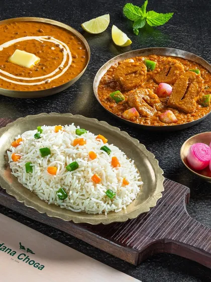 A non-vegetarian meal combo from Dana Choga with dal makhani, soya chaap curry, and rice.
