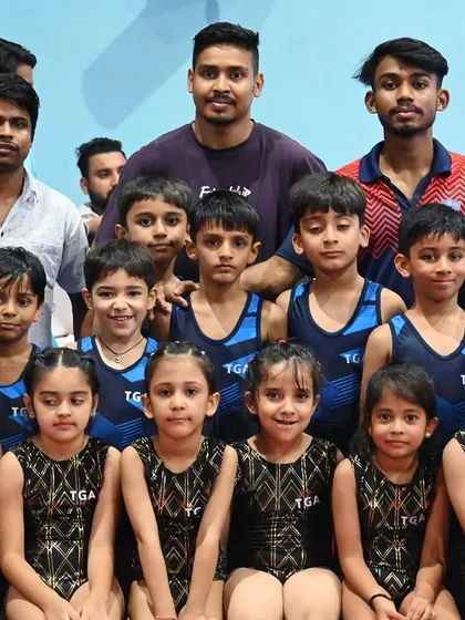 The whole squad. A group photo of our junior gymnasts and their dedicated coaches.