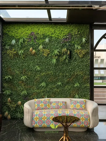 We bring nature indoors with zero maintenance. This artificial green wall serves as a stunning biophilic backdrop in a living area, adding texture, color, and a sense of vitality without the need for water or sunlight.