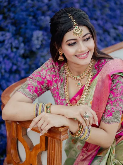 A happy, smiling portrait of the bride. The makeup is fresh and radiant, perfect for capturing the joy of her special day.