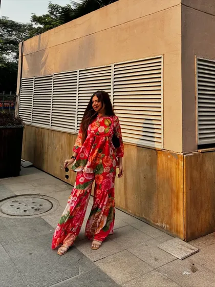 A vibrant red floral co-ord set that's perfect for summer. The flowing fabric and bold print make it a head-turning outfit.