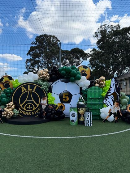 The main stage for our football-themed party, featuring a giant football, the birthday boy's name and age, and a PSG-inspired logo.