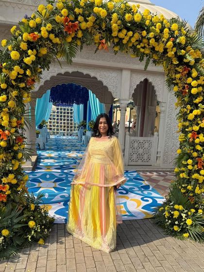 This client looks like a ray of sunshine in her custom yellow outfit at a beautiful outdoor event. My goal is always to help you find pieces that not only fit perfectly but also match the joy of the occasion.