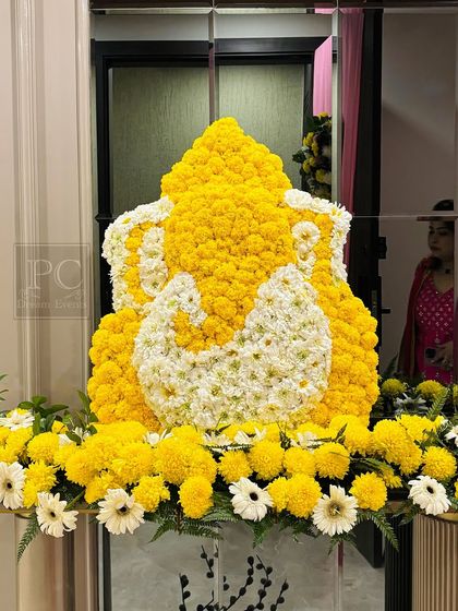Another view of the beautiful floral Ganesha. This traditional decoration is a popular choice for bringing blessings and positive energy to any auspicious event.