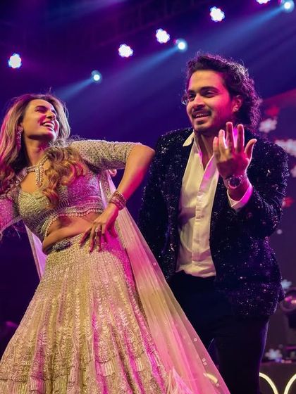 A high-energy moment from a couple's duet. Our choreography blends individual styles with synchronized moves to create a performance that is both personal and polished.