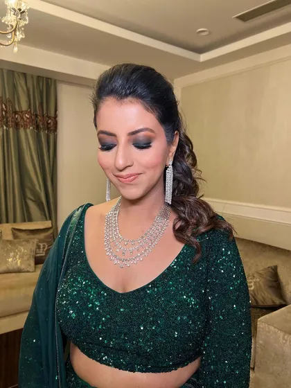 Eyes closed, this shot highlights the intense smokey eye makeup.