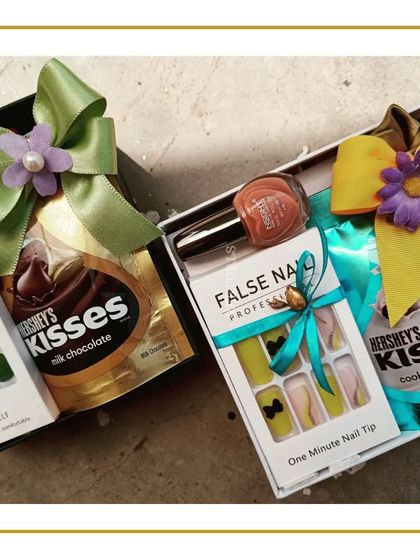 A colorful assortment of bridesmaid gifts, including press-on nails and Hershey's Kisses, showcasing different color themes and combinations available.