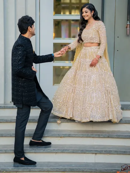 A chivalrous moment as Apoorv helps Shikha up the stairs. This storytelling shot adds a touch of romance and narrative to their engagement photos.
