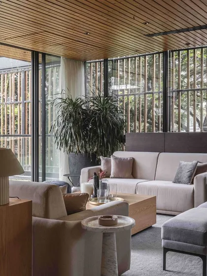A view of the lounge seating, where we used soft, neutral upholstery and modern forms to create a comfortable and stylish space.