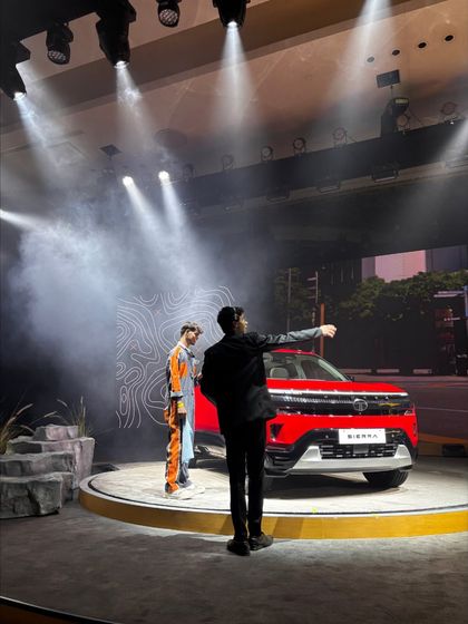 Our stage manager directing the placement and presentation of the TATA Sierra during a rehearsal. This hands-on coordination is key to a flawless automotive reveal.